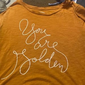 Yellow old navy shirt slightly used. Small tear at top